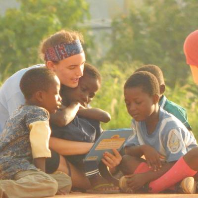 A volunteer reading to children at her Childcare Project in Ghana A Projects Abroad volunteer reading to children at her Spring Break Childcare Project in Ghana